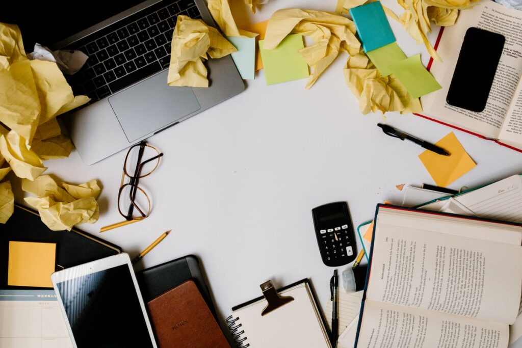 messy desk with scattered papers